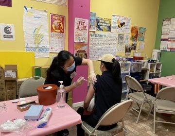 A pharmacist giving a community member the Pfizer vaccine on March 21 in South Philadelphia during Juntos and VietLead’s organized vaccination event. (Courtesy of Thy Vu)