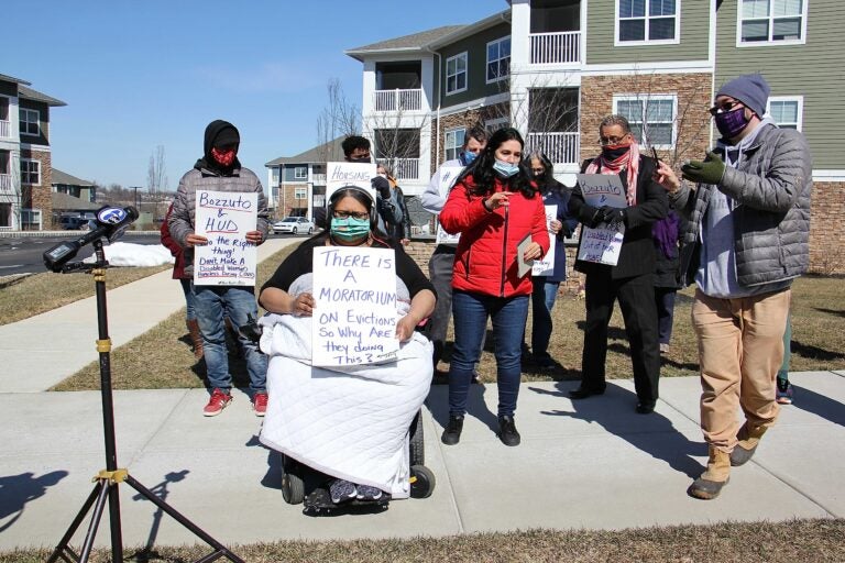 Manisha Divecha, 33, is joined by supporters outside her apartment complex in Malvern