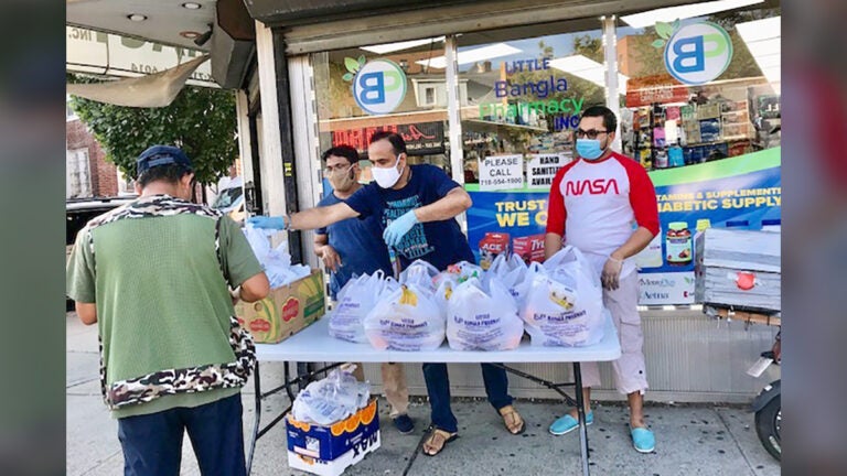 Community health workers and field staff assisting with food delivery during the COVID-19 pandemic