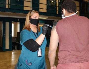 A person who is incarcerated receives a COVID-19 vaccine