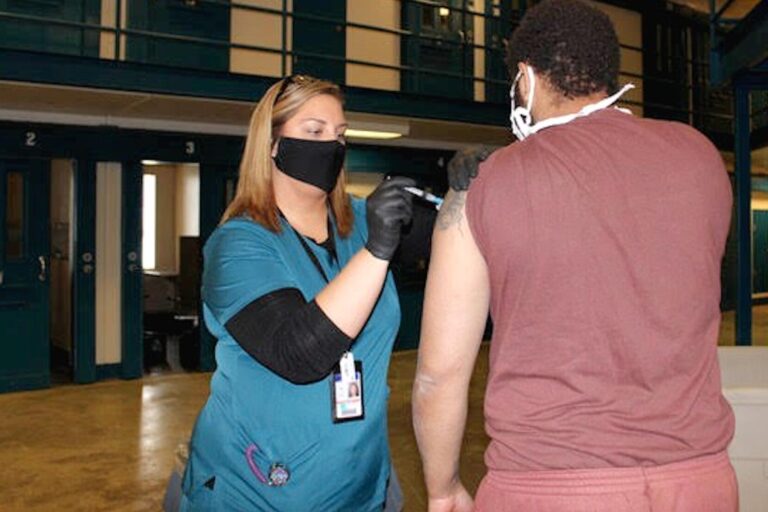 A person who is incarcerated receives a COVID-19 vaccine