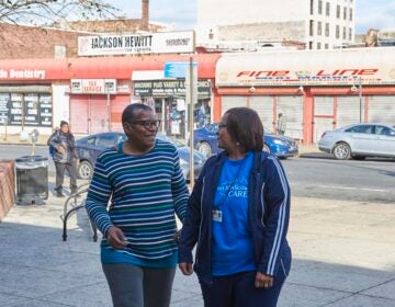 West Philadelphia resident Phyllis Carter (left) takes a walk with her community health worker