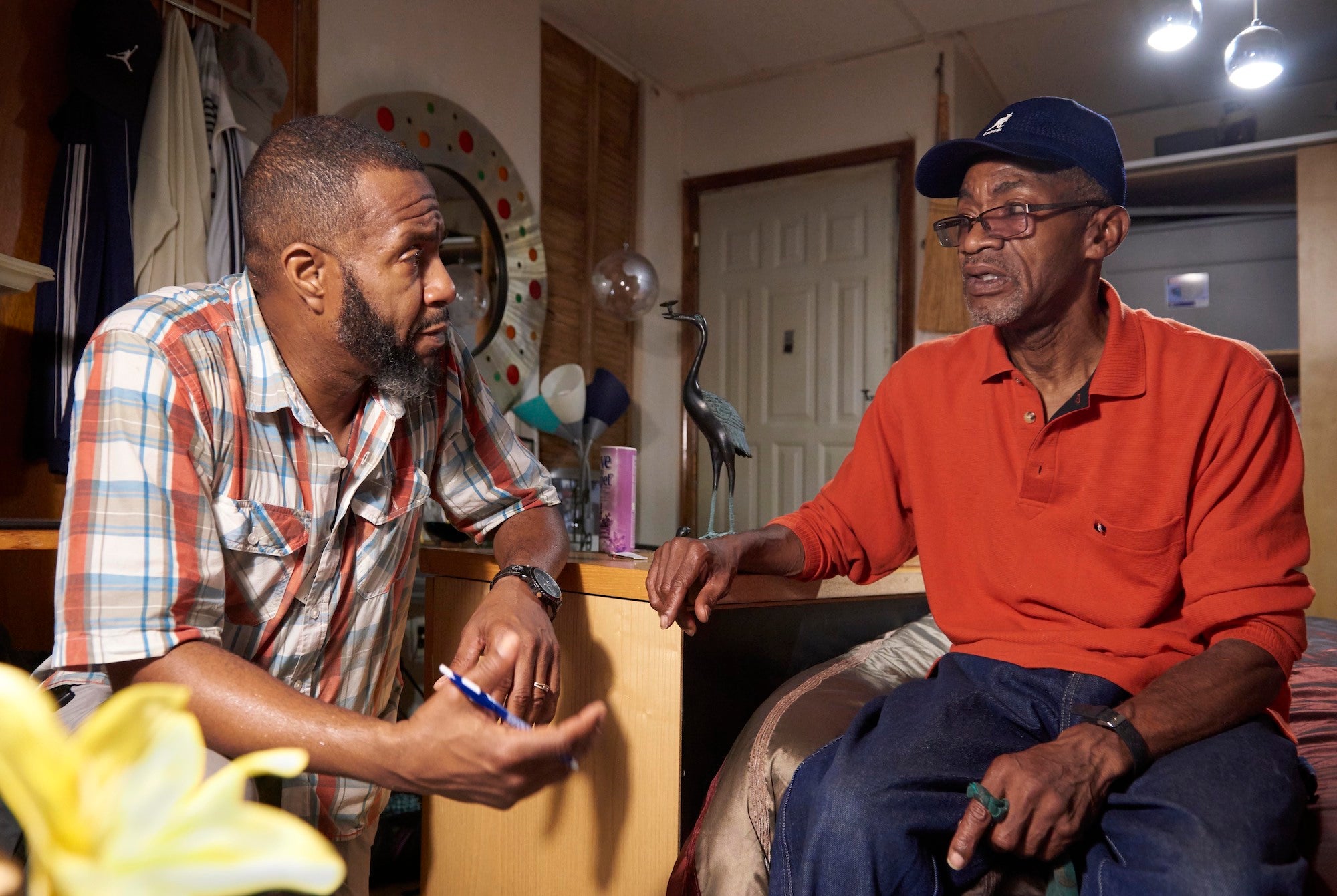 Orson Brown (left) listens to patient Walter Briggs