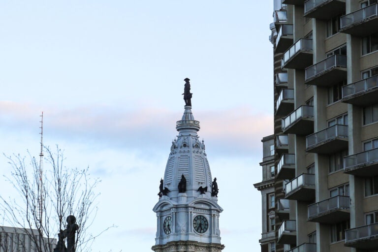 When viewing the statue atop City Hall of William Penn from the Benjamin Franklin Parkway, Penn's hand might appear to be a different sort of bodily appendage. (Conrad Benner/WHYY)