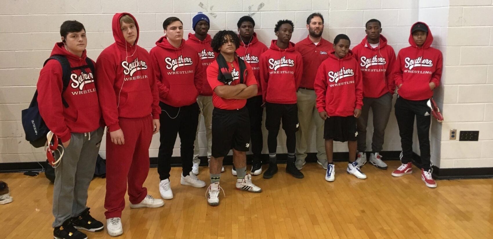 Tahj Williams, third from right, with South Philly High School's wrestling team during the 2017-2018 school year. (Courtsey: of Robert Schloss)