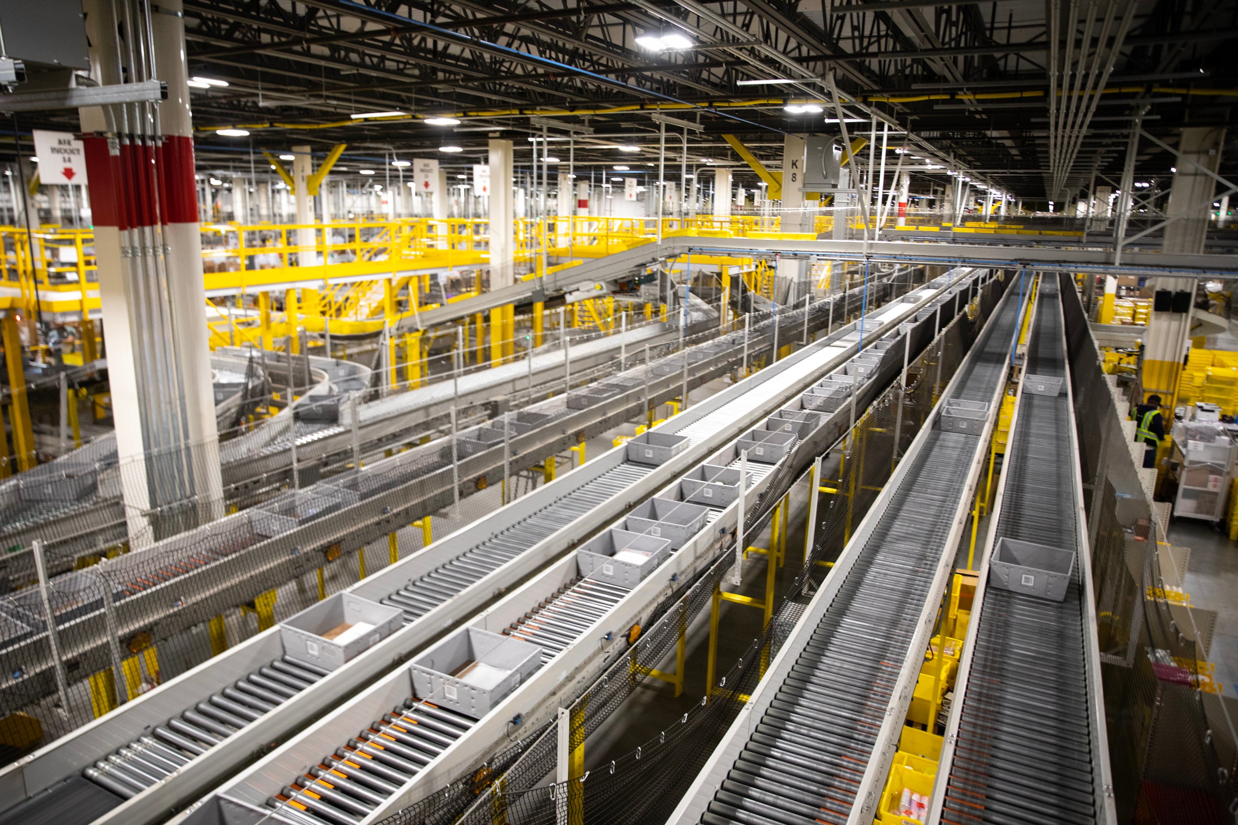 Conveyor belts are pictured an Amazon fulfillment center