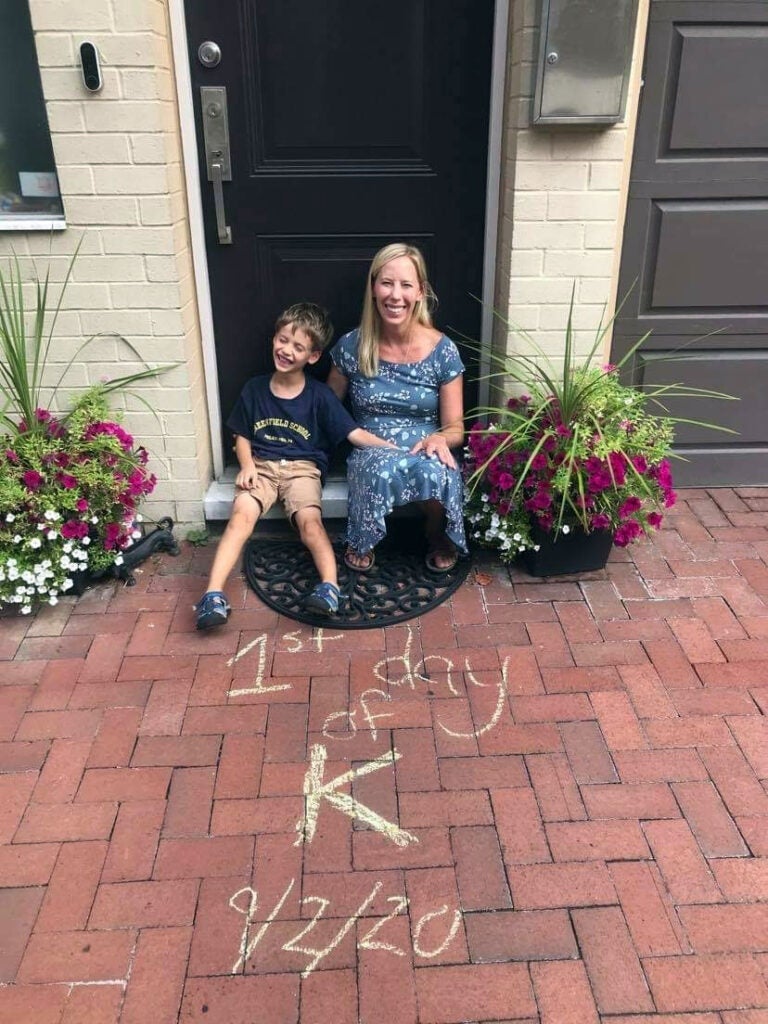Amy Liesenfeld Blumenthal sits with her son, Joseph, outside their home.