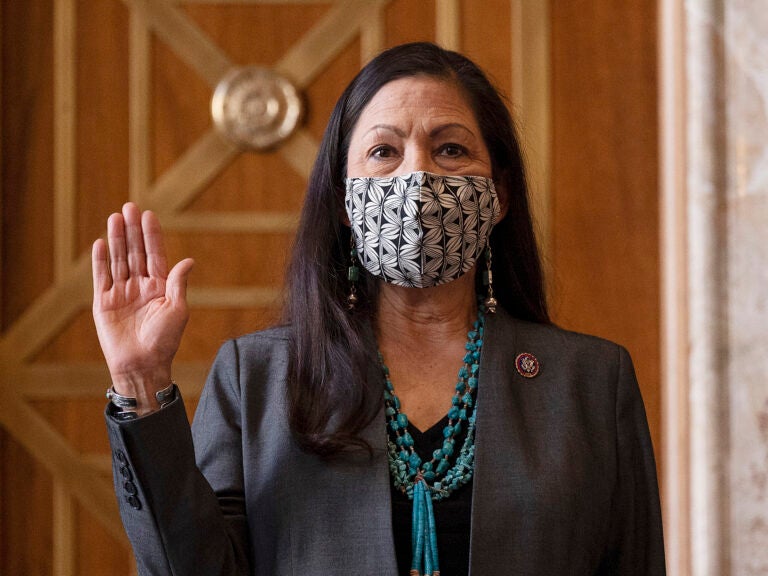 Rep. Deb Haaland, D-N.M., is sworn in before her Senate confirmation hearing to be Interior Secretary last month. Her confirmation makes her the country's first Native American cabinet secretary. (Jim Watson/AP)