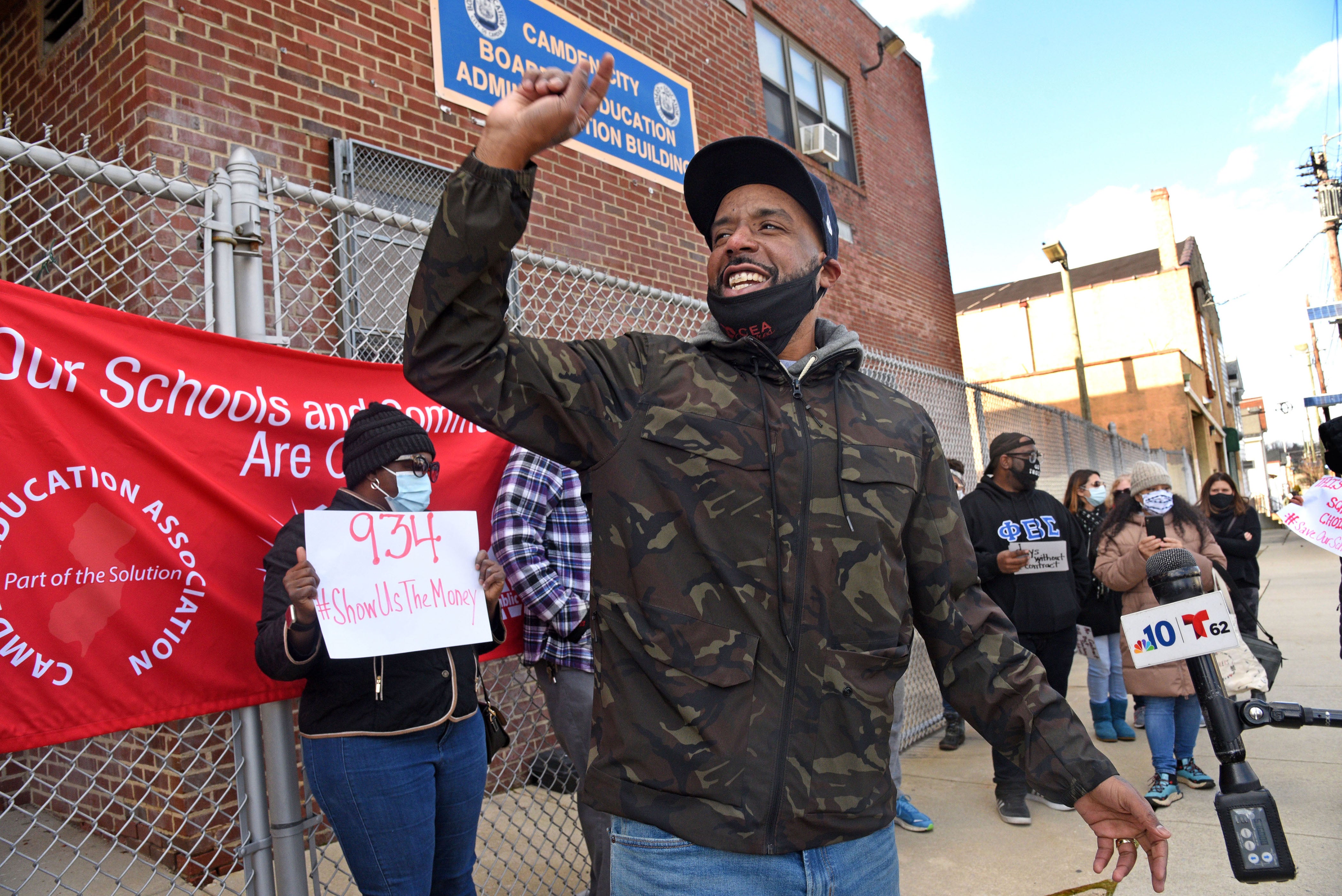 Keith Benson addresses protesters and the media at a rally