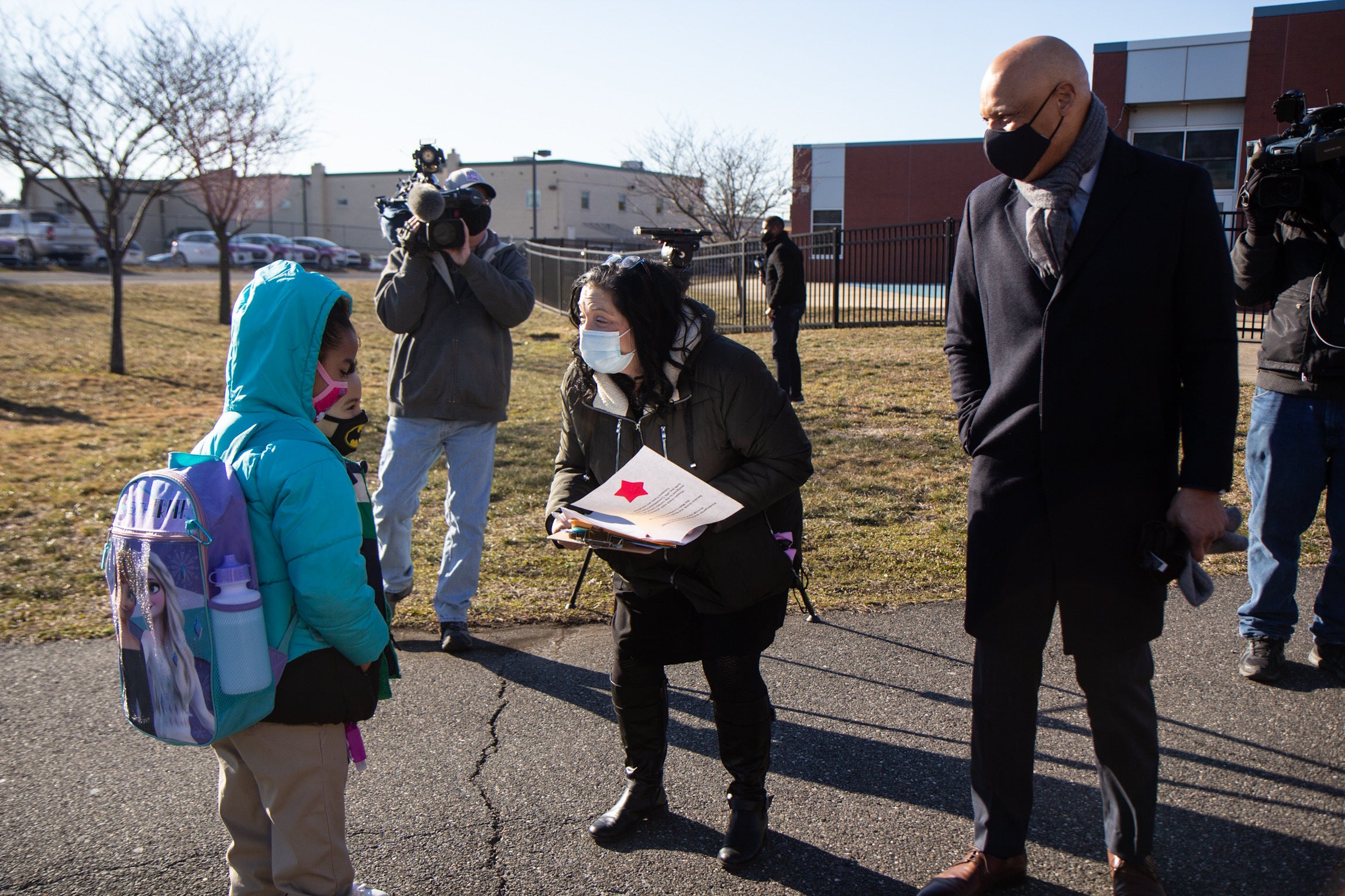 Philadelphia School District Superintendent William Hite and Mayor Jim Kenney greet returning students