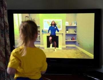 Four-year-old Lois Copley-Jones, the photographer's daughter, takes part in a livestreamed broadcast of 