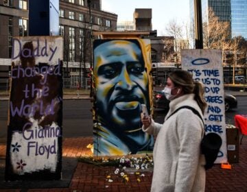 A painting of Floyd is seen outside the Hennepin County Government Center