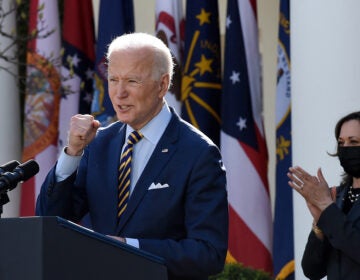 President Biden, with Vice President Harris behind him, speaks about the American Rescue Plan in the Rose Garden of the White House on Friday.