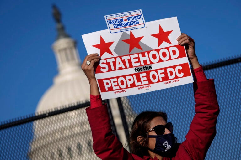 Residents of the District of Columbia rally for statehood near the U.S. Capitol