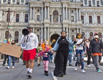 Protesters march down Broad Street