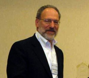 Psychologist Jeffrey Sternlieb stands against a wall