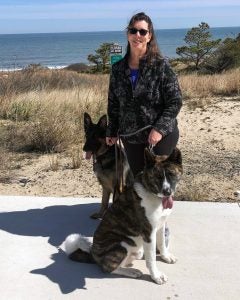 Psychologist Laura Epstein at Cape Henlopen Beach park with her two dogs