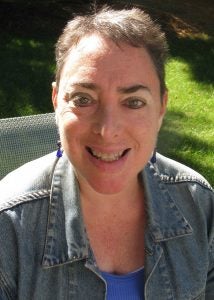 Psychologist Peggy Rothbaum sits outside