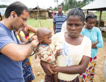 Dr. Raj Panjabi, the newly named head of the President's Malaria Initiative, treating patients during a visit to Liberia, where he was born and lived until 1990. He'll lead the effort to prevent and treat malaria around the world. Each year, some 400,000 people die of a disease that, he notes, is 