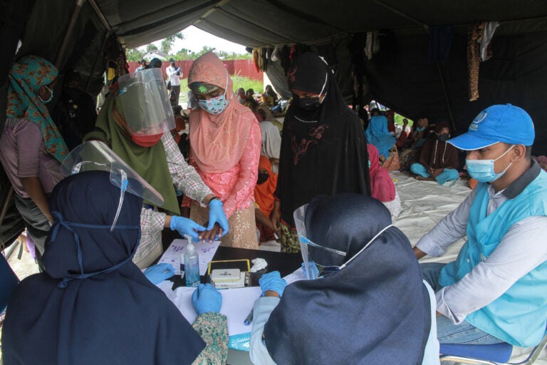 Rohingya refugees at a work training center in Indonesia's Aceh province. Dr. Paul Spiegel of Johns Hopkins University's Center for Humanitarian Health is looking at the data that have been collected on refugees and other vulnerable populations. It's far from complete, he says, but he has been surprised by the impact of COVID-19 among Rohingya. (Khalis Surry/Anadolu Agency via Getty Images)