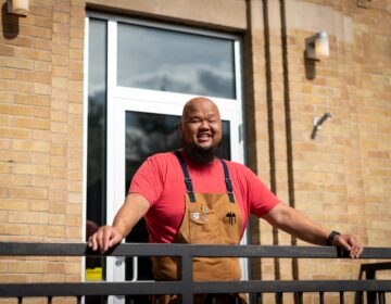 Chef Yia Vang's restaurant in Minneapolis is getting ready to open amid a fierce debate within the restaurant industry about the minimum wage. The restaurant will ban tipping.