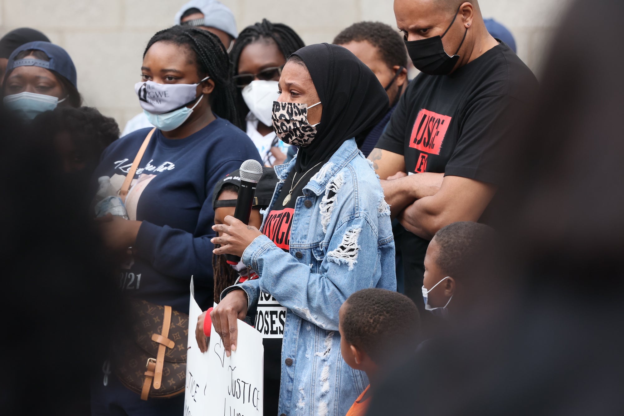 Lymond Moses widow Amanda Spence gives remarks during a We Still Can’t Breathe March Against Police Brutality