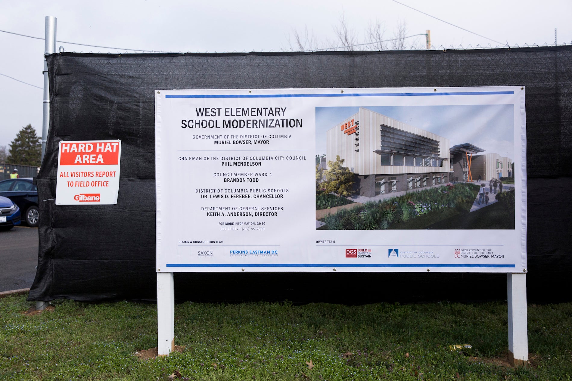 A projected image of the modernized West Elementary is shown outside of the school's construction area