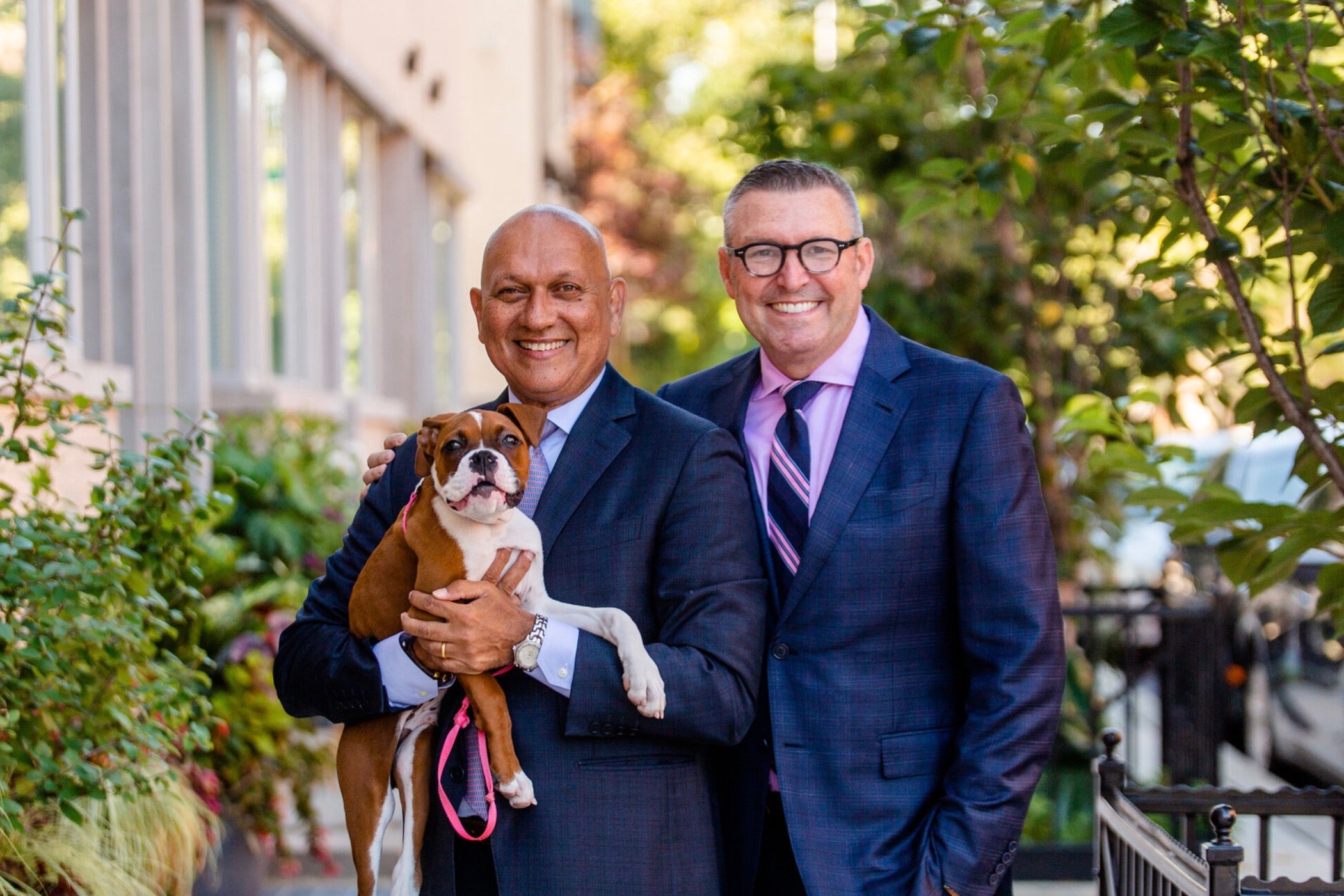 Emergency room Dr. Kevin Baumlin (right) pictured with his husband Patrick and their boxer Duke