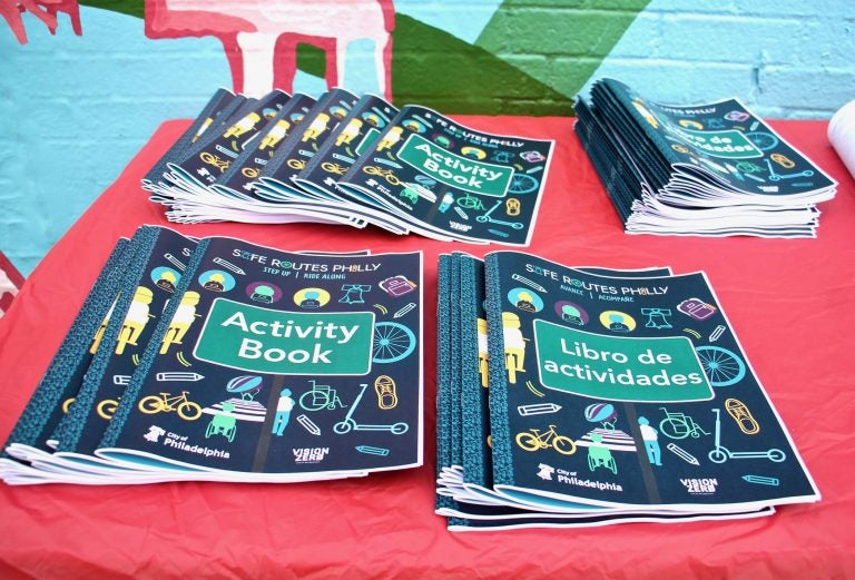 Activity books aimed at children in Pre-K through 5th grade will be used to bring the Safe Routes Philly program to William Cramp and other elementary schools. (Emma Lee/WHYY)