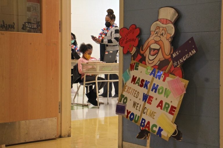 Students settle in at their desks