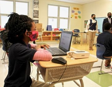 Students settle in at their desks