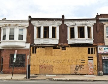 Graffiti on a boarded-up home under construction at 52nd and Delancey streets warn of unrest if the killer of George Floyd is not convicted