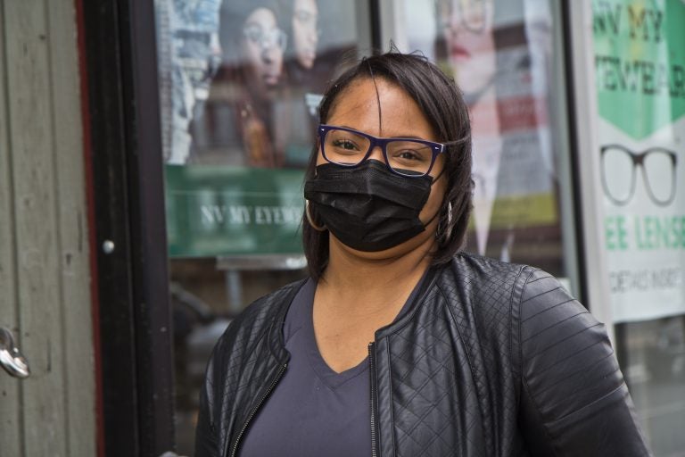 Tiffany Ward, owner of NV My Eyewear on 52nd Street, in front of her store on April 21, 2021. (Kimberly Paynter/WHYY)