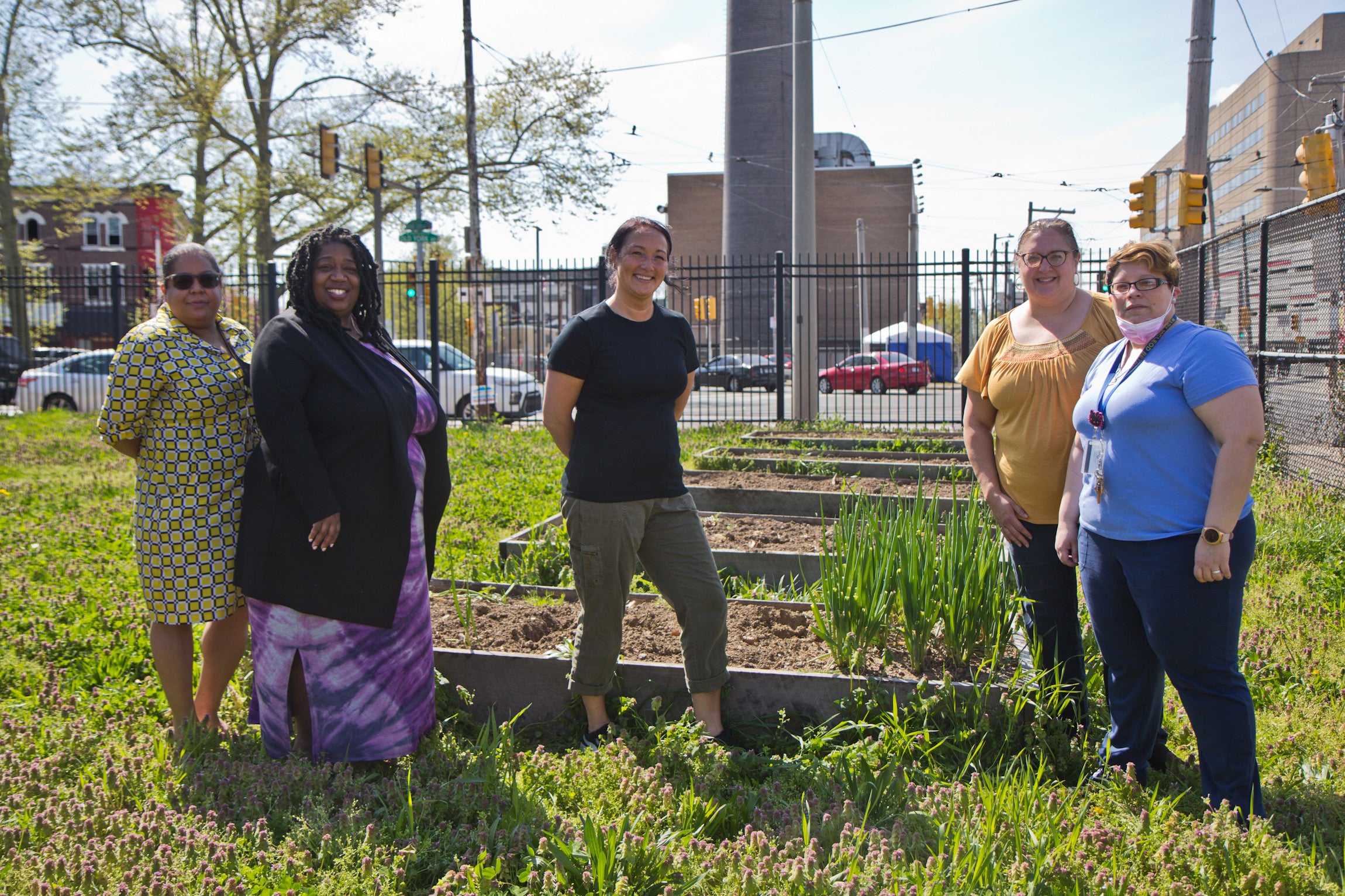 (From left) Assistant principal Yasim Evangelista, principal Aliya Catanch-Bradley, 2nd grade teacher Diane Balanovich, 2nd grade teacher Marianne Marino and Head Start teacher Lena Quiroz stand with the flower boxes they built at Mary McLeod Bethune Elementary. (Kimberly Paynter/WHYY)