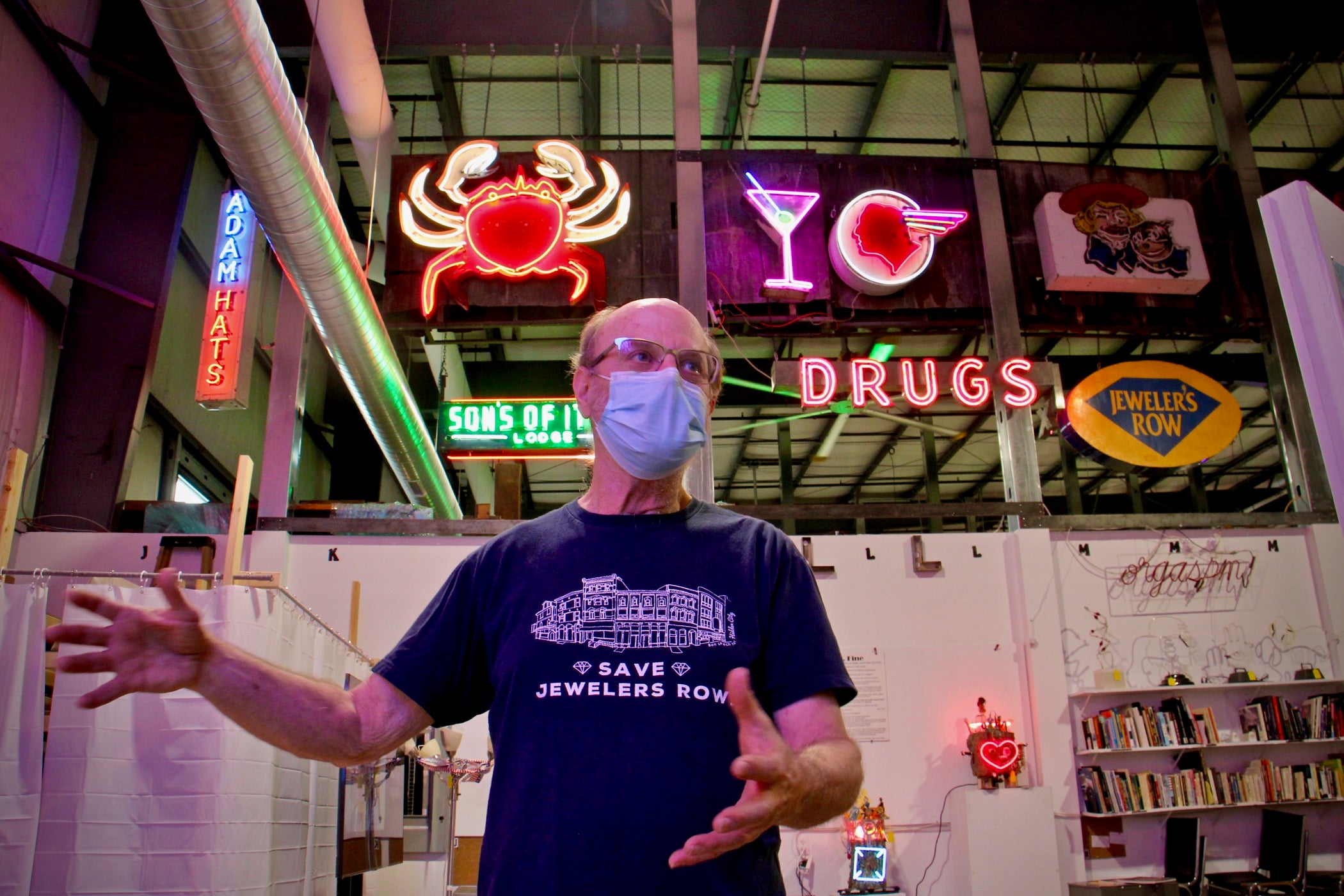 Len Davidson leads a tour of the Neon Museum of Philadelphia, housed in the NexFab Building in Kensington. (Emma Lee/WHYY)