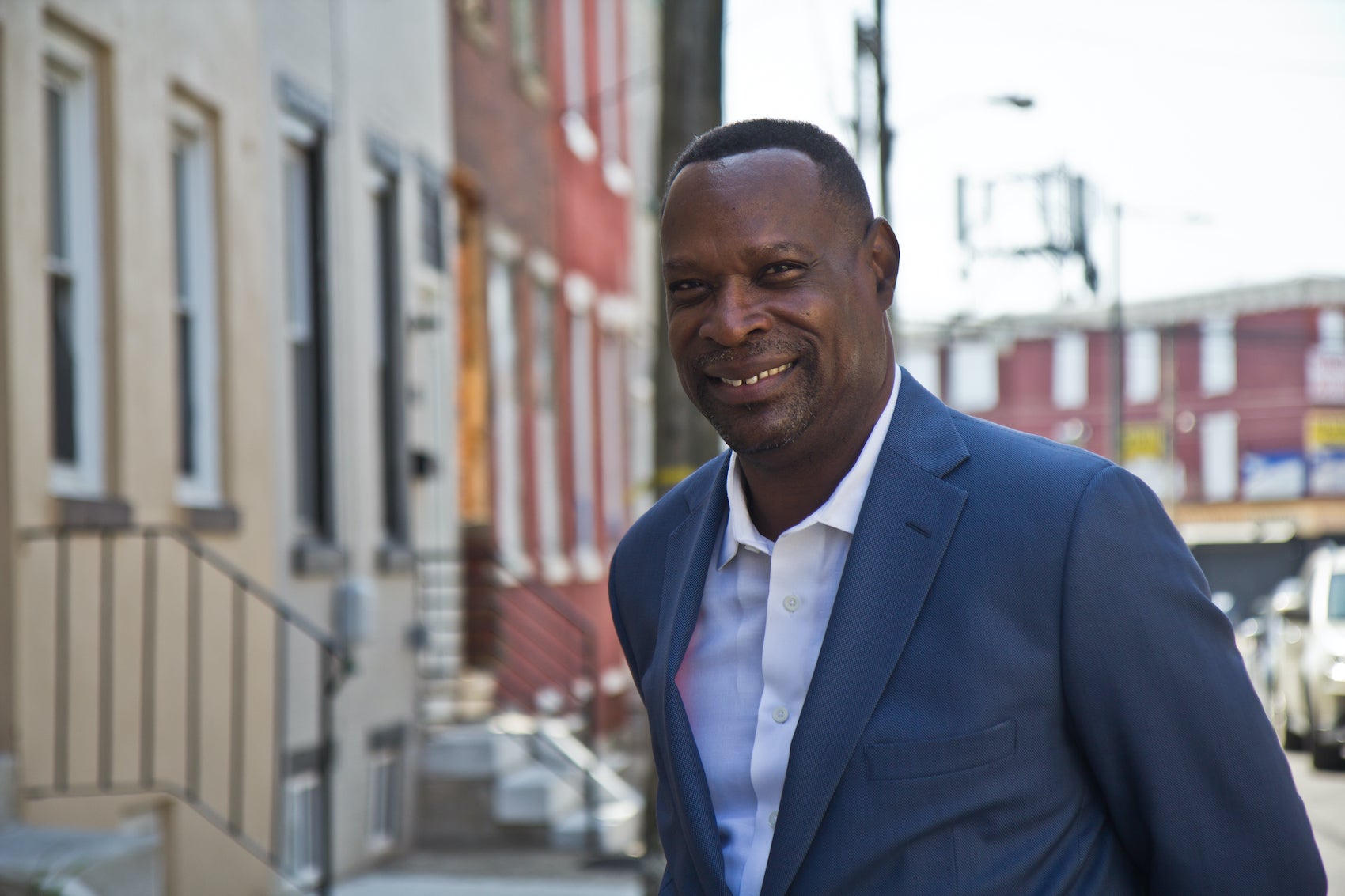 Anthony Fullard in front of a West Philly property