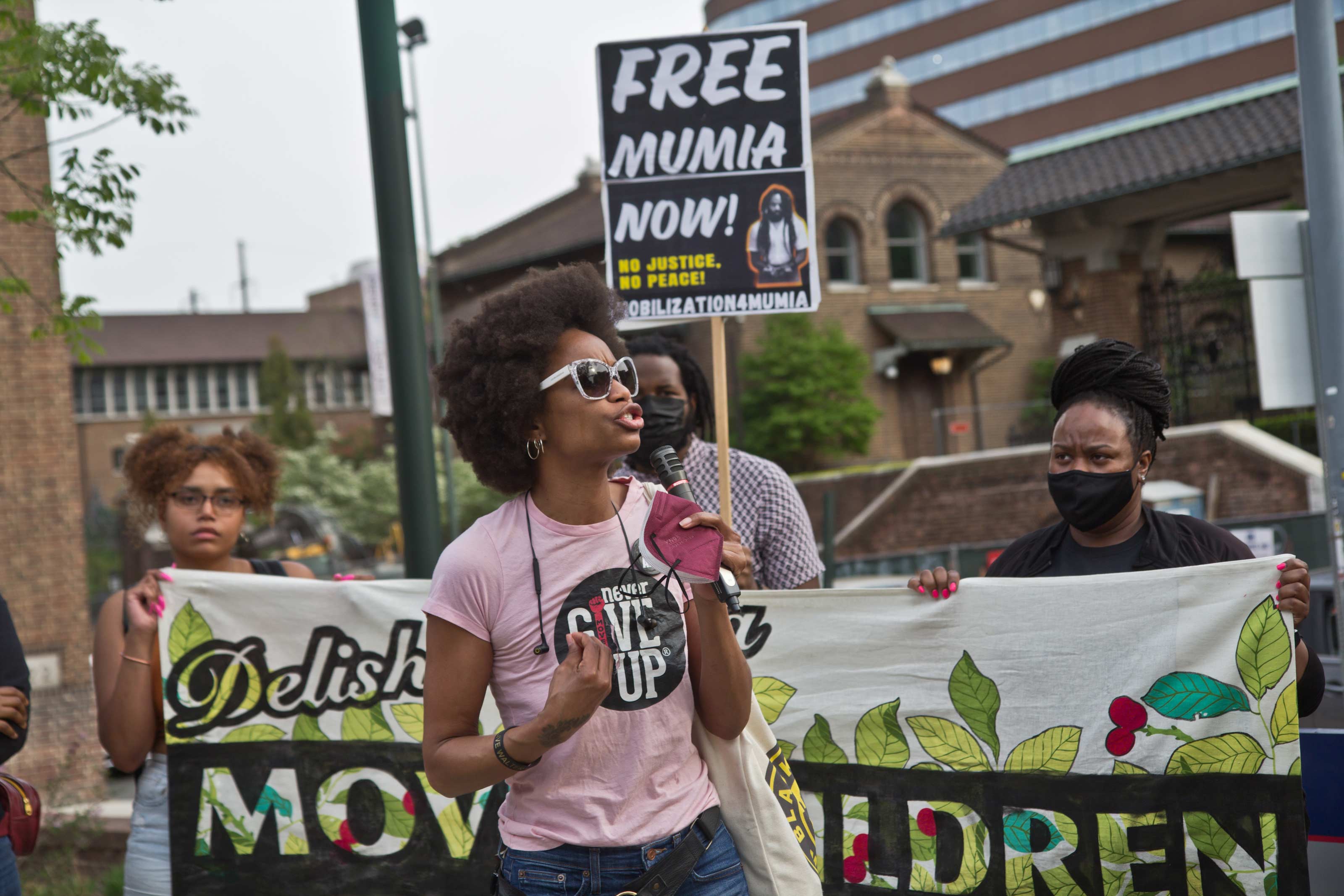 Black Lives Matter organizer YahNé Ndgo protested outside Penn Museum on April 28, 2021, over the museum’s mistreatment of the remains of children Tree and Delisha Africa who were killed when the city bombed the MOVE organization’s headquarters in 1985. (Kimberly Paynter/WHYY)