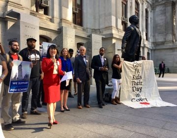 In 2018, advocates talk to the press outside Philadelphia’s city hall after a court appearance in the fair funding case now scheduled to go to trial in September. (Darryl C. Murphy/The Notebook)