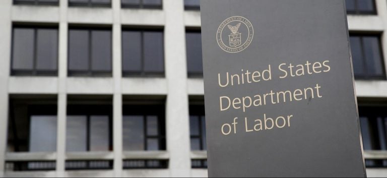 In this May 6, 2020 photo, a sign stands outside the Department of Labor's headquarters in Washington.