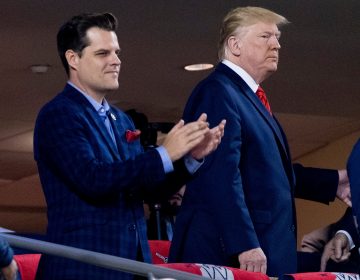 In this Oct. 27, 2019, file photo President Donald Trump, right, accompanied by Rep. Matt Gaetz, R-Fla., left, arrive for Game 5 of the World Series baseball game between the Houston Astros and the Washington Nationals at Nationals Park in Washington. (AP Photo/Andrew Harnik)