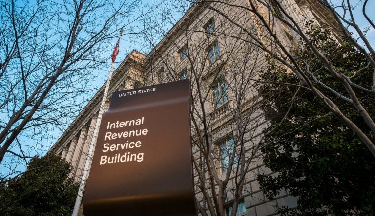 FILE - In this April 13, 2014 file photo, the Internal Revenue Service Headquarters (IRS) building is seen in Washington. More than 50 of the largest U.S. companies paid nothing in federal income taxes last year, even though they reported big pretax profits as a group. That's according to the Institute on Taxation and Economic Policy, a group that believes the tax system needs to raise more revenue. (AP Photo/J. David Ake, File)