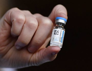 In this March 3, 2021, file photo, the Johnson & Johnson COVID-19 vaccine is held by pharmacist Madeline Acquilano at Hartford Hospital in Hartford, Conn. (AP Photo/Jessica Hill)