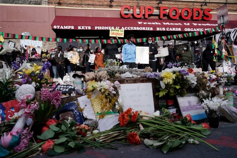 People gather at Cup Foods after a guilty verdict was announced at the trial of former Minneapolis police Officer Derek Chauvin for the 2020 death of George Floyd, Tuesday, April 20, 2021, in Minneapolis, Minn. Former Minneapolis police Officer Derek Chauvin has been convicted of murder and manslaughter in the death of Floyd. (AP Photo/Morry Gash)