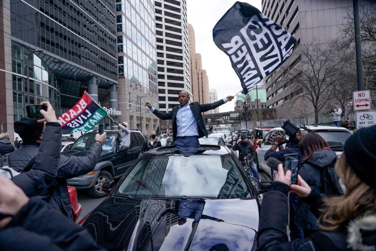 People rally outside the courthouse in Minneapolis on Tuesday, April 20, 2021, after the guilty verdicts were announced in the trial of former Minneapolis police officer Derek Chauvin in the death of George Floyd. George Floyd's killing last year and the protests that followed led to a wave of police reforms in dozens of states, from changes in use-of-force policies to greater accountability for officers. At the same time, lawmakers in a handful of states have had success addressing racial inequities. (AP Photo/Morry Gash)