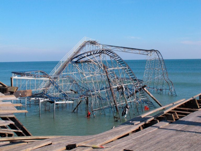 This Nov. 29, 2012 file photo shows the Jet Star roller coaster sitting in the ocean in Seaside Heights N.J. one month after Superstorm Sandy knocked it off Casino Pier into the water. (AP Photo/Wayne Parry)