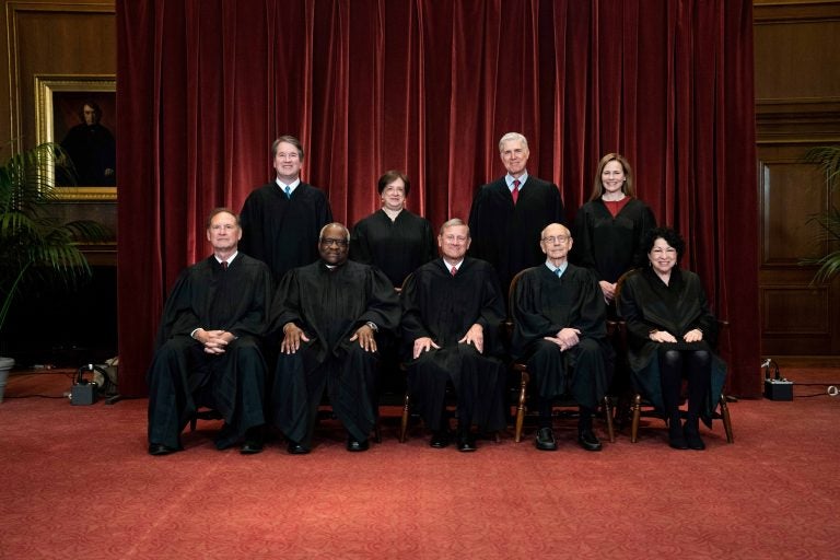 In this April 23, 2021, file photo members of the Supreme Court pose for a group photo at the Supreme Court in Washington. Seated from left are Associate Justice Samuel Alito, Associate Justice Clarence Thomas, Chief Justice John Roberts, Associate Justice Stephen Breyer and Associate Justice Sonia Sotomayor, Standing from left are Associate Justice Brett Kavanaugh, Associate Justice Elena Kagan, Associate Justice Neil Gorsuch and Associate Justice Amy Coney Barrett. Before the Supreme Court this is week is an argument over whether public schools can discipline students over something they say off-campus. (Erin Schaff/The New York Times via AP, Pool, File)