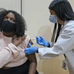 Keidy Ventura receives her first dose of the Pfizer COVID-19 vaccine