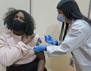 Keidy Ventura receives her first dose of the Pfizer COVID-19 vaccine