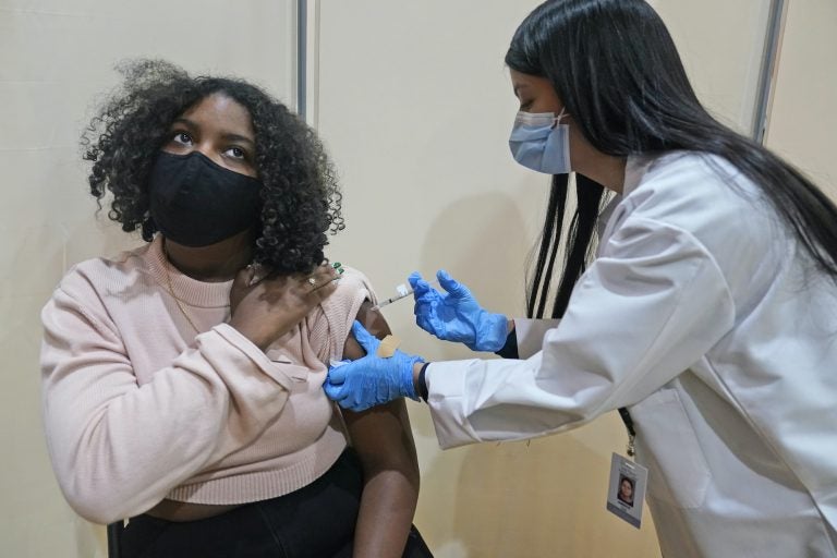 Keidy Ventura receives her first dose of the Pfizer COVID-19 vaccine