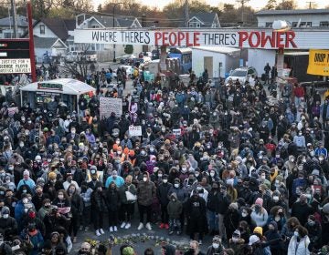 Demonstrators gather outside Cup Foods to celebrate the murder conviction of former Minneapolis police officer Derek Chauvin in the killing of George Floyd